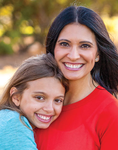 Woman and daughter smiling